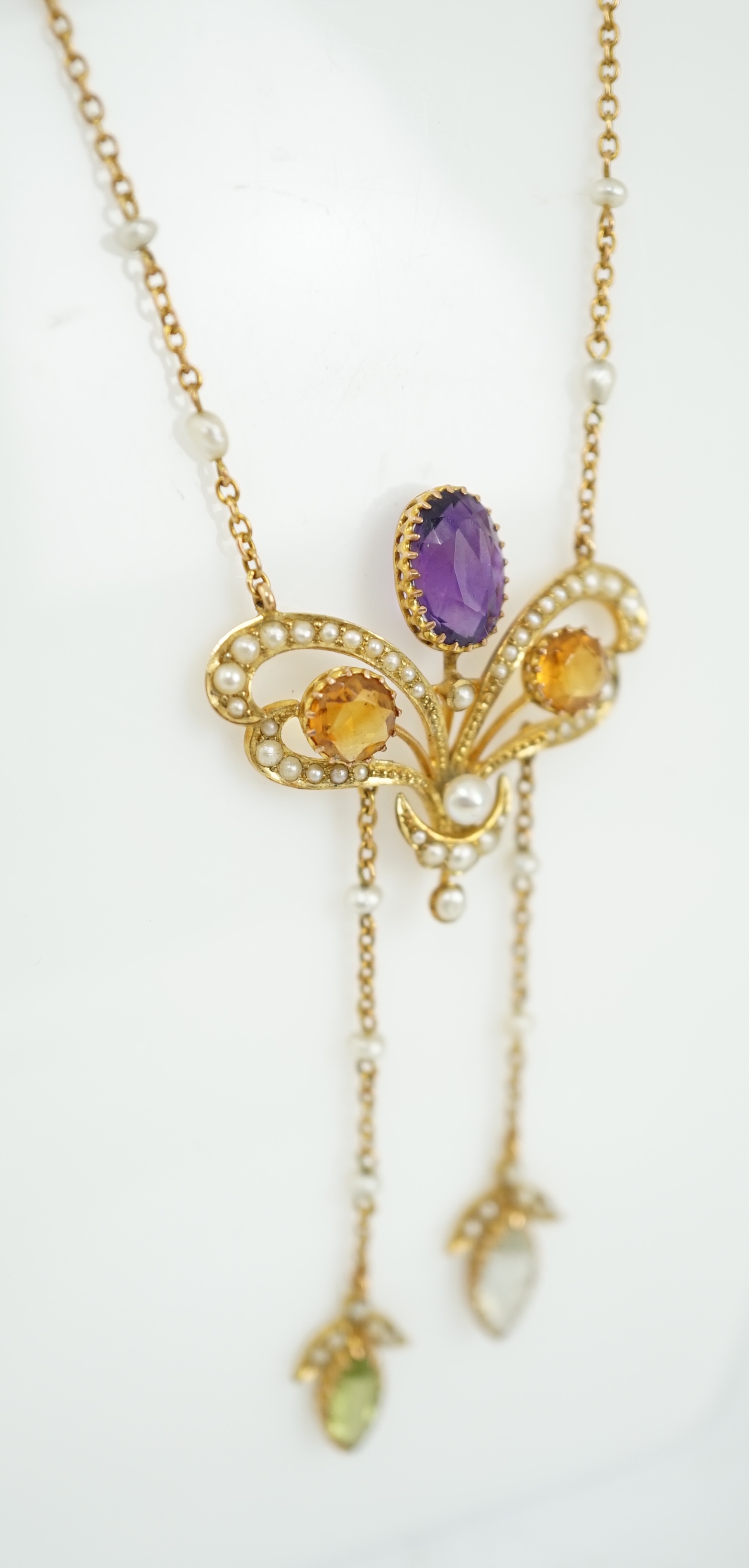 An Edwardian yellow metal, seed pearl and multi gem set double drop pendant necklace